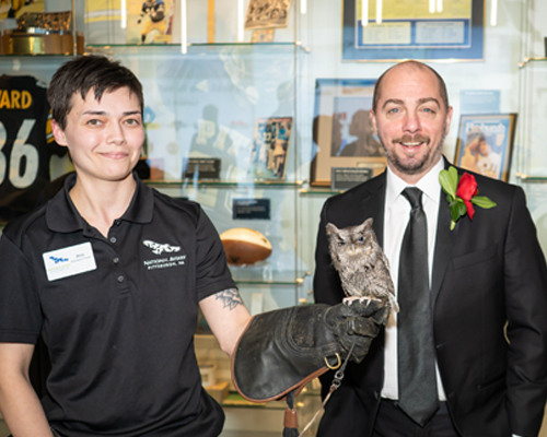 Michael Mascaro at the Aviary standing beside an owl